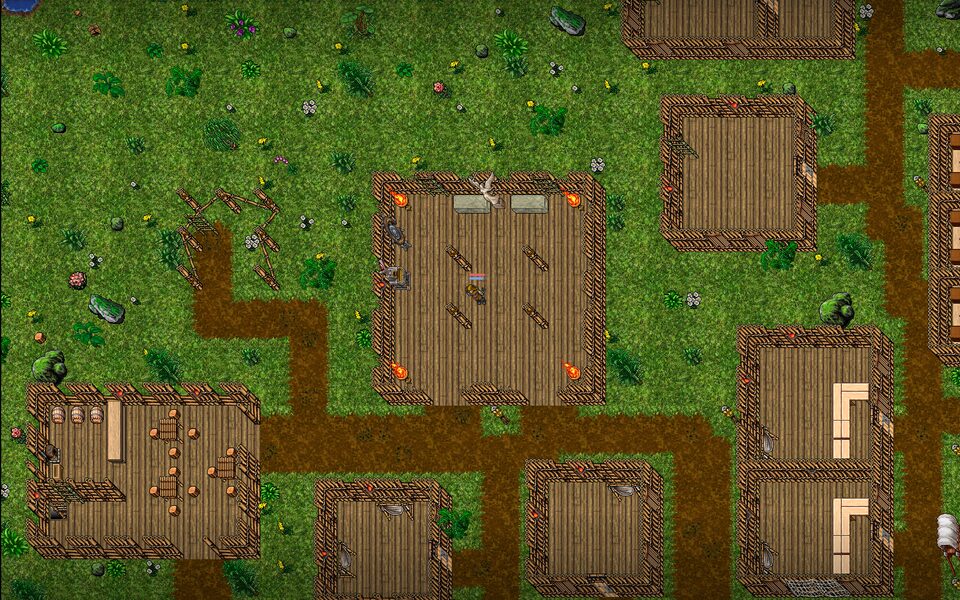 A jungle settlement of timber huts and dirt roads.